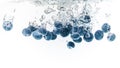 BlueberryÃ¢â¬â¢s splashing into crystal clear water with air bubbles Royalty Free Stock Photo